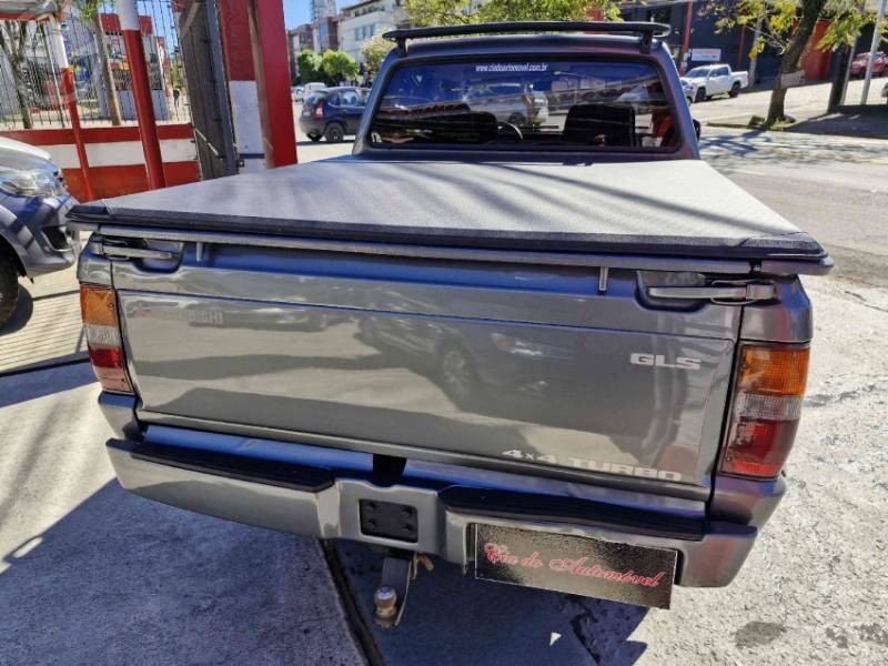 MITSUBISHI - L200 2.5 GLS HPE 4X4 CD 8V TURBO DIESEL 4P MANUAL - 2002/2003 - CINZA - R$ 59.000,00
